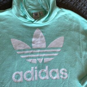 Mint green adidas hoodie. Side snaps